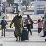 Europeans with 'combat experience' have been called on to help in the bitter struggle against despot Vladimir Putin's forces. Pictured: A man in olive-coloured military regalia is seen at the Polish/Ukraine border
