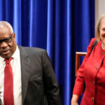 WASHINGTON, DC - OCTOBER 21: (L-R) Associate Supreme Court Justice Clarence Thomas and his wife and conservative activist Virginia Thomas arrive at the Heritage Foundation on October 21, 2021 in Washington, DC. Clarence Thomas has now served on the Supreme Court for 30 years. He was nominated by former President George H. W.  Bush in 1991 and is the second African-American to serve on the high court, following Justice Thurgood Marshall. (Photo by Drew Angerer/Getty Images)