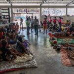 UNOCHA/Giles Clarke "Displaced people take shelter in a boxing arena in central Port-au-Prince after fleeing their homes following gang attacks".