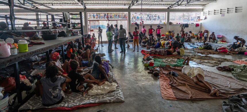 UNOCHA/Giles Clarke "Displaced people take shelter in a boxing arena in central Port-au-Prince after fleeing their homes following gang attacks".