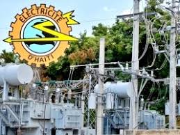 Electrical substation with transformers and overhead power lines; Électricité d'Haïti logo in the top-left.